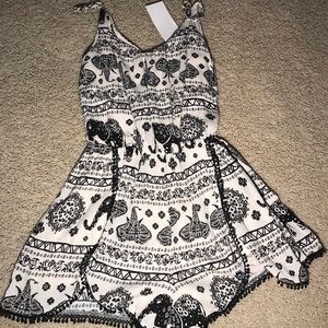Black and cream elephant romper